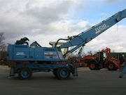 ФУКС 360 с грейфером для лома