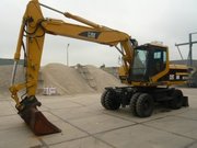 Колесный экскаватор Caterpillar M318