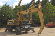 Caterpillar  M 318 MH-перегружатель
