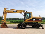 Caterpillar M318,  колесный экскаватор